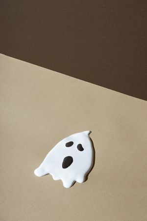 Ghost on beige and brown background