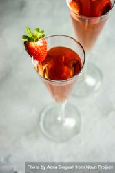 Pink champagne with strawberry slice 42vjq4