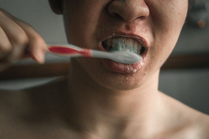 Boy brushing his teeth