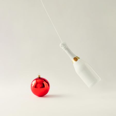 Champagne bottle with red bauble