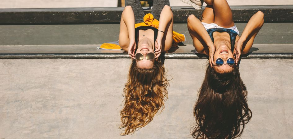 Female friends having fun at skate park on a summer day