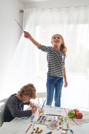 Children bonding while drawing pictures