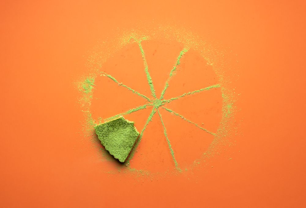 Last matcha cheesecake slice partially eaten