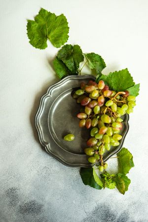 Fresh grapes on grey plate
