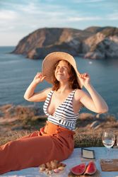 Woman resting in meadow on picnic