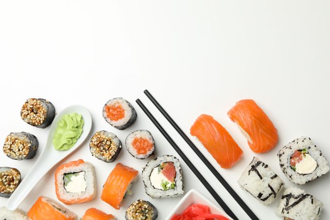 Delicious sushi rolls on plain background, top view. Japanese food