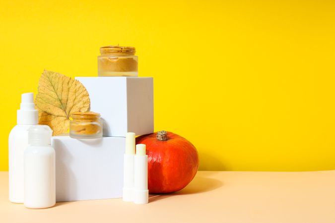 Skin care and face care concept - pumpkin cosmetic