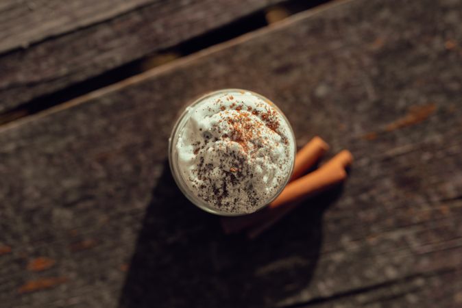 Cinnamon near coffee on table