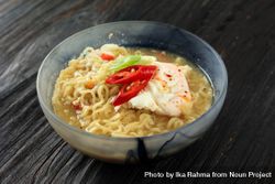 Bowl of instant ramen noodles with egg and vegetables 5l9qN4