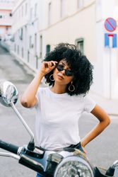 Stylish female on motorbike