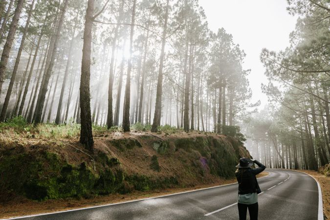 Woman in foggy forest