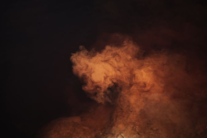 Smoke over water in brown light