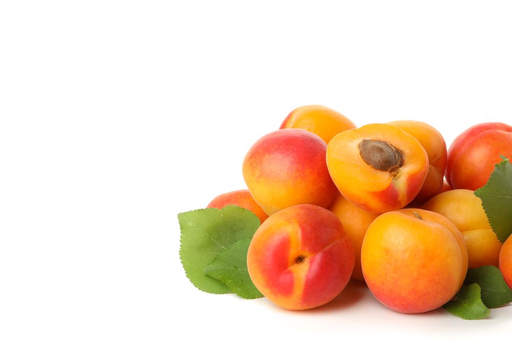Fresh tasty apricots isolated on blank background