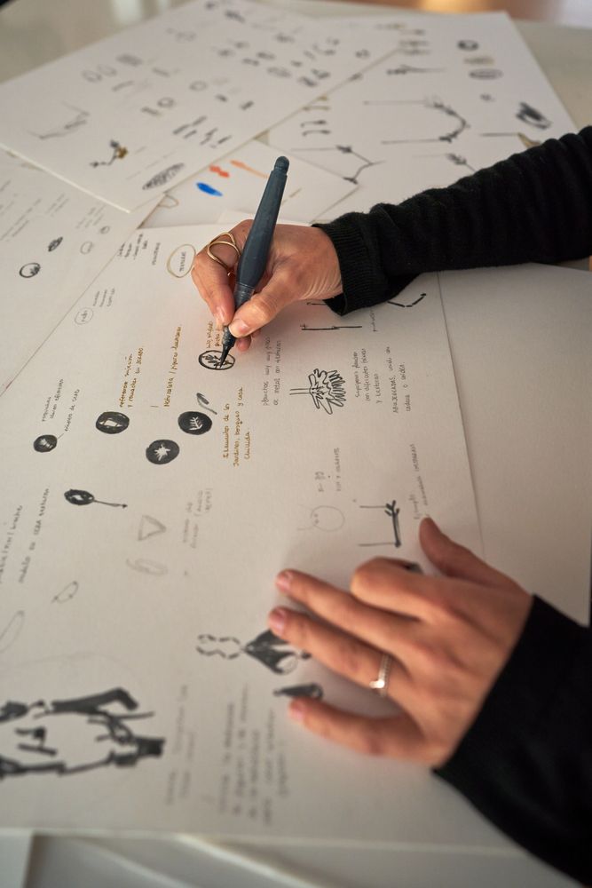 Designer drawing sketch on paper at workplace