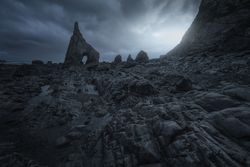 Rocky coast and rainy dark sky