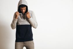 Man looking down hiding face
