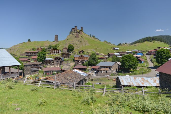 Tall old defensive building in majestic mountains in summer sunny day