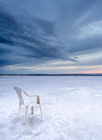 Chair on salt mine during sunset
