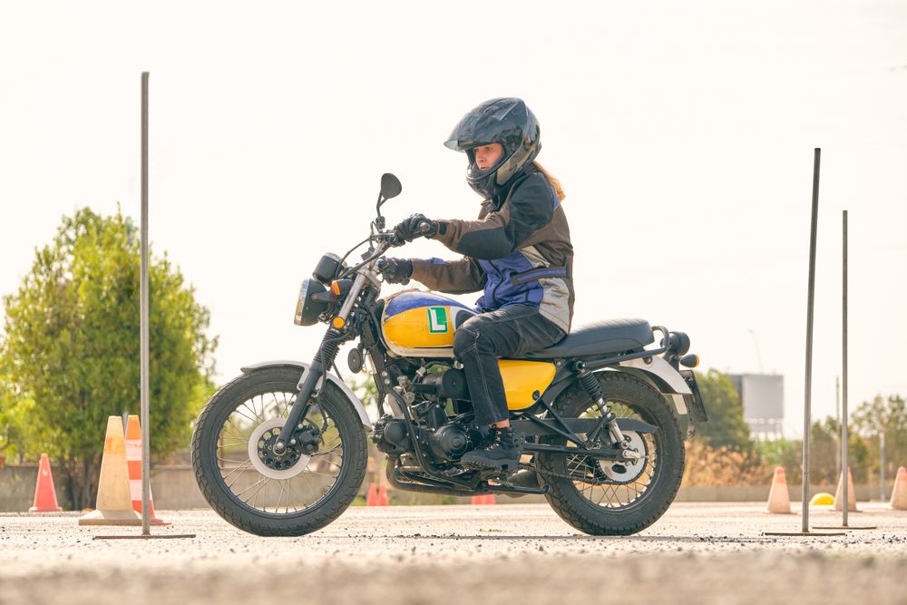 Woman riding motorcycle on motordrome