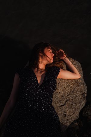 Sensual woman resting on lake shore