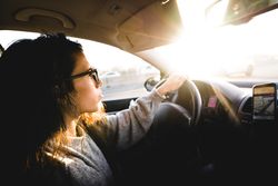 Young woman driving car