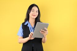 Portrait of Young Asian Woman Company Worker Smiling and Holding Digital Tablet Computer
