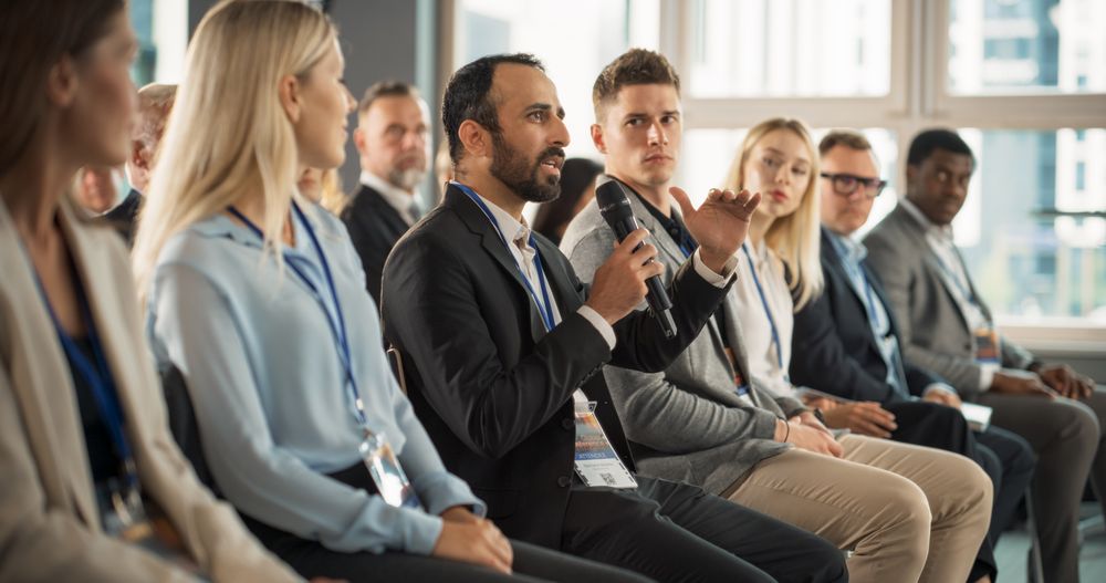 Middle Eastern Man At International Tech Forum.