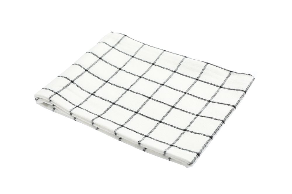 Folded fabric napkin isolated on plain background