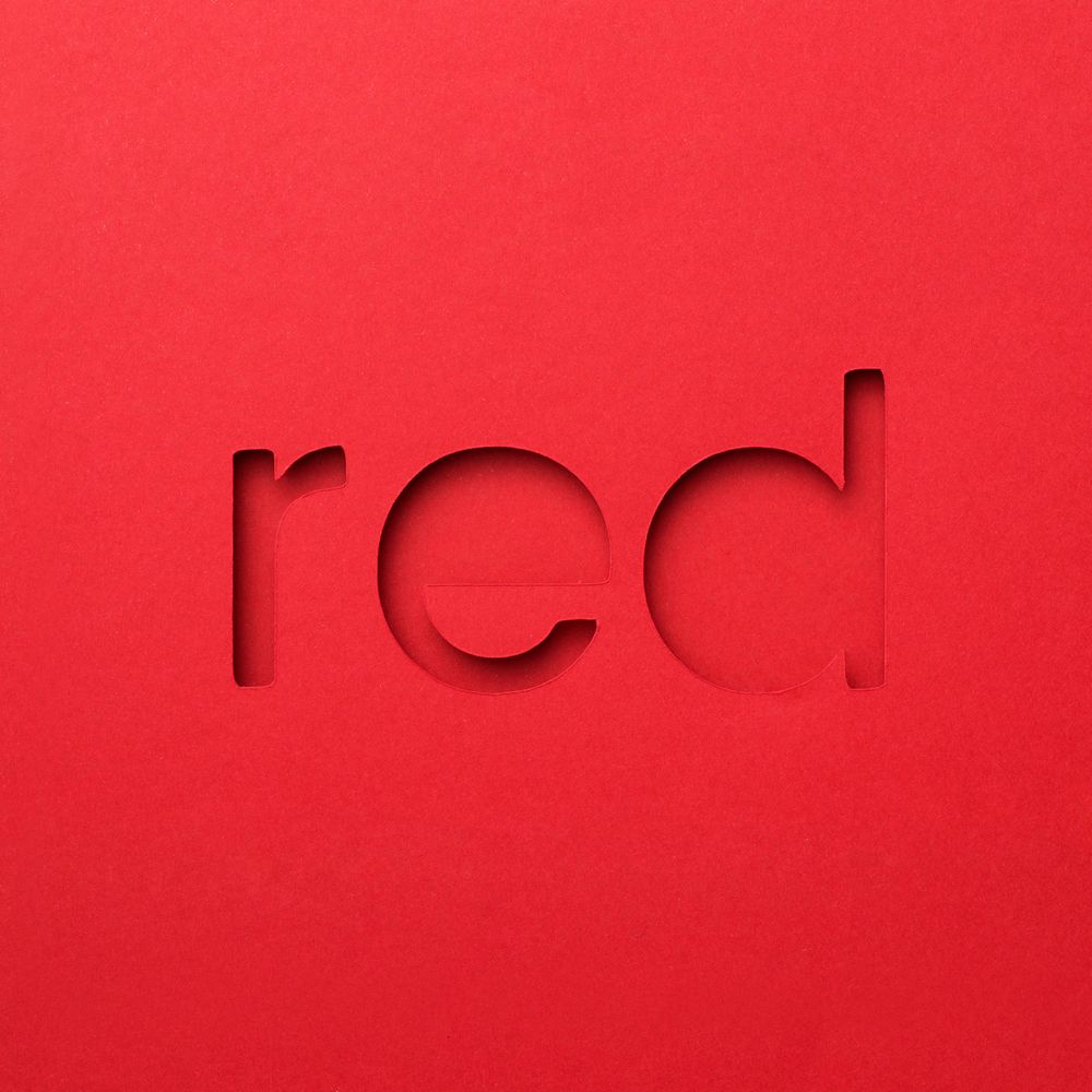 Red word made of paper over red background