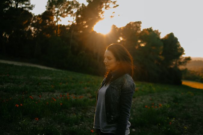 Woman walking on meadow and enjoying freedom