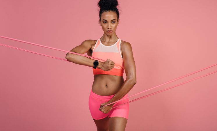 Tough woman using a resistance band in her exercise routine