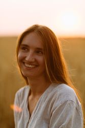 Happy woman smiling and looking away in countryside