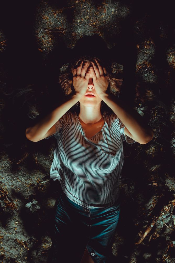 Woman lying on ground
