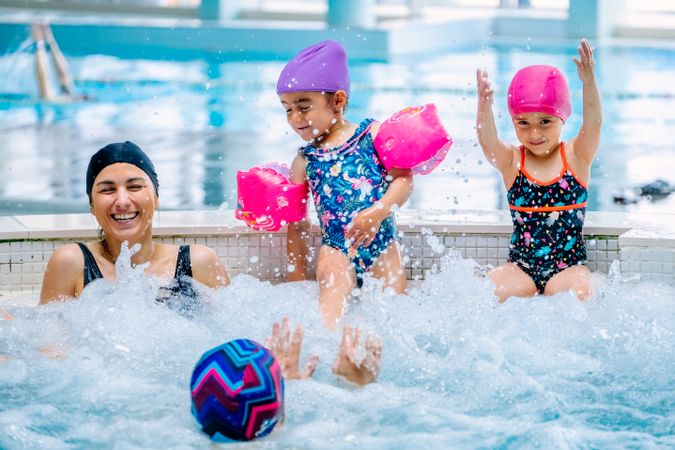 Family relaxing in bubbling pool