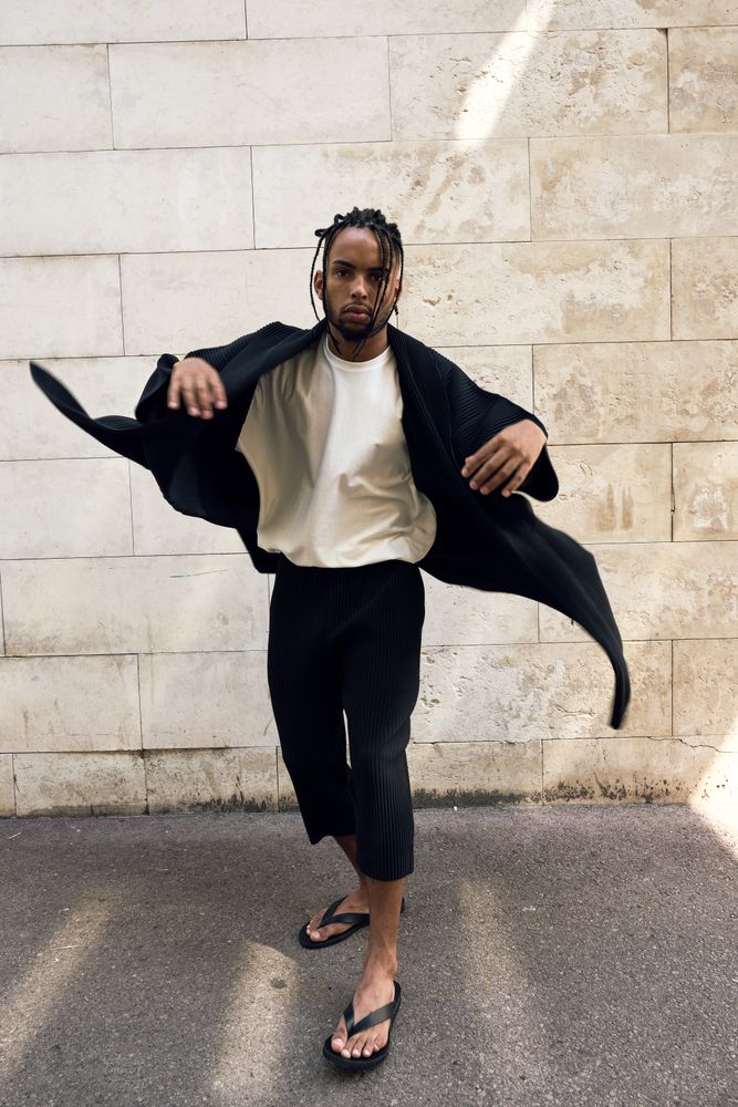 Trendy Black man posing on street