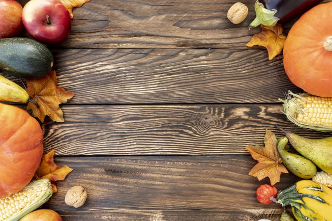 Autumnal frame on wooden table with copy space