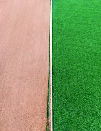 Drone vertical panorama with agricultural fields and countryside road