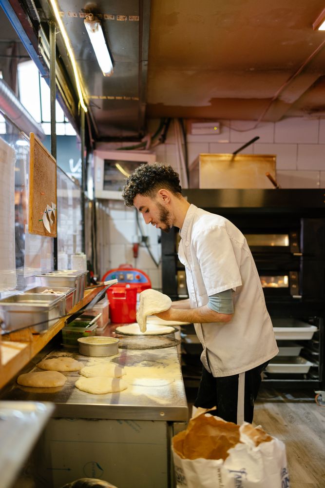 Pizza man making pizza shape
