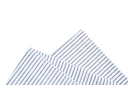 Folded fabric napkin isolated on plain background