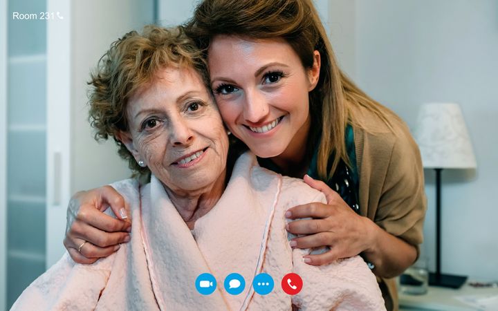 Video call screen with older woman in hospital