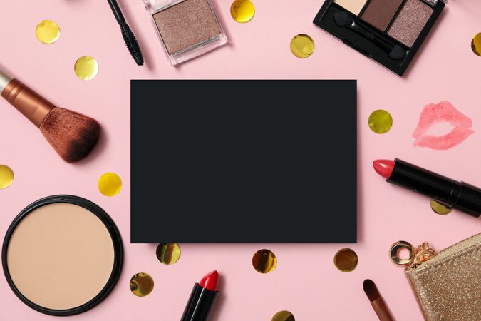 Different cosmetics and space for text on pink background
