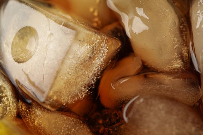 Side view of cola and ice, close up