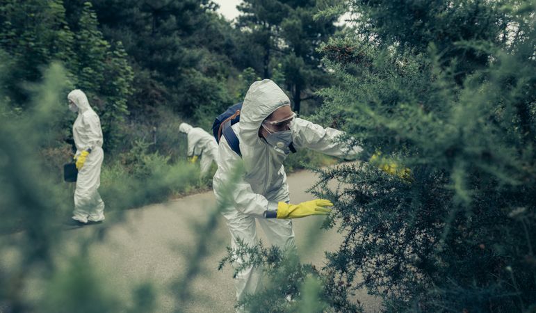People with protection suits looking for evidence
