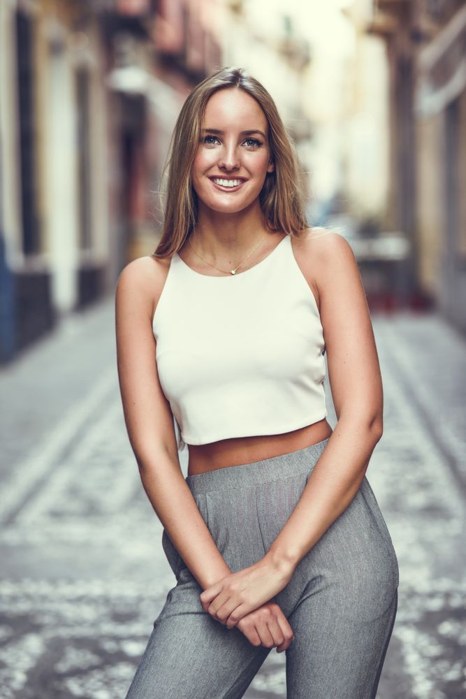 Happy chic woman in the street