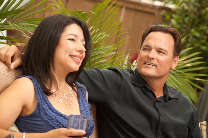 Hispanic and White Couple Drinking Wine