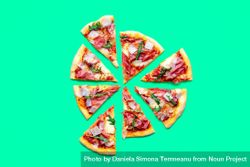 Ham pizza top view minimalist on a green table 0Wwej0