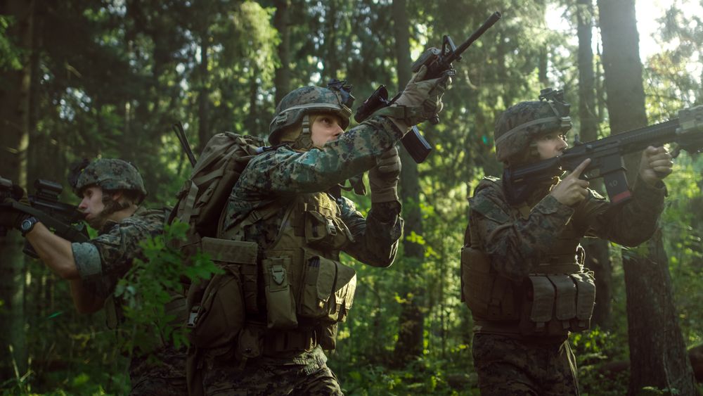 Fully Equipped Soldiers Wearing Camouflage Uniform Attacking Enemy