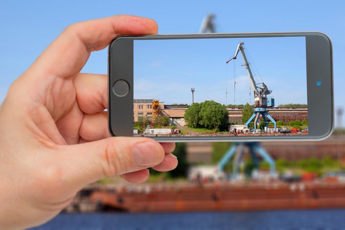Person taking photo of crane