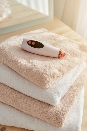 Pore cleaner on stack of towels