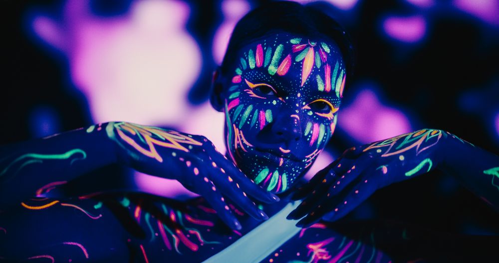 Stunning Modern Dance Choreography by a Young Creative Woman Covered in Colorful Glowing Body Paint